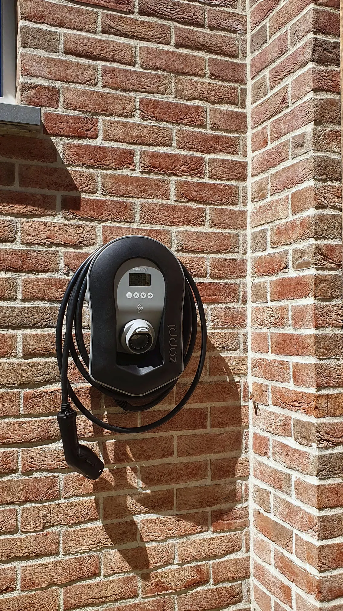 Project: EV charger on a brick facade